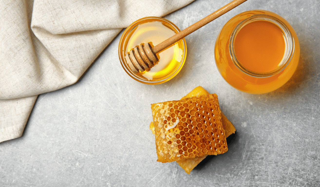 Beeswax with jar of honey